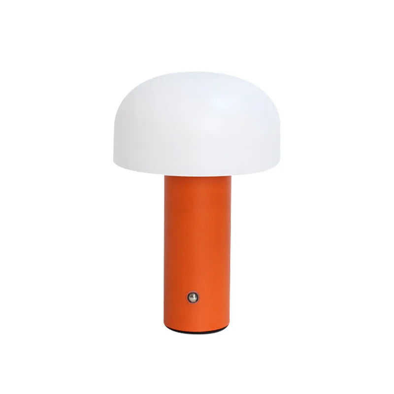 USB-powered table lamp in choice of black, white, orange or green, featuring a built-in charging port