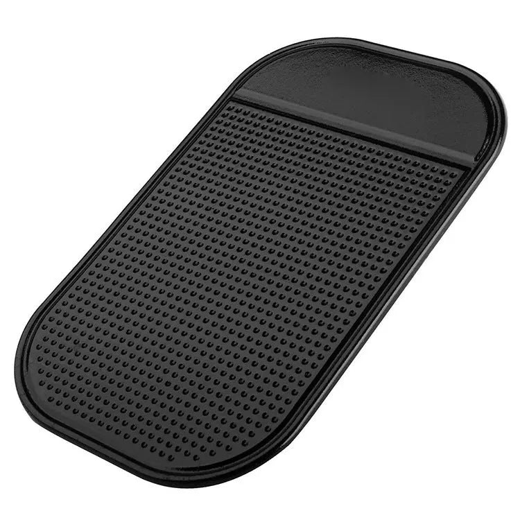 Black silicone spider anti slip mat for car dashboard measuring 13 by 7 centimetres