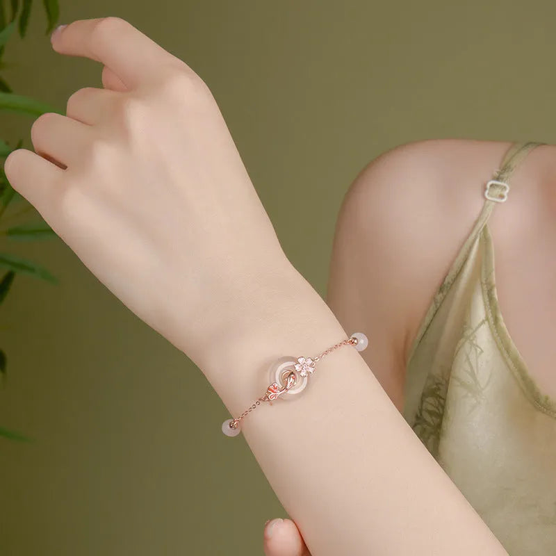 S925 sterling silver women's bracelet with white chalcedony crystal and Koi-themed new Chinese floral design.