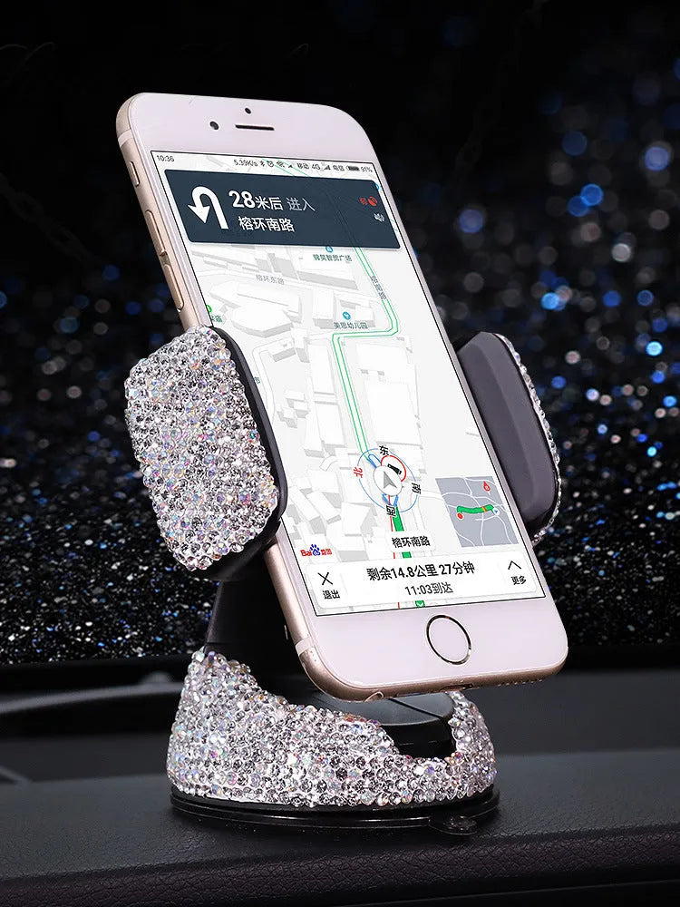 Crystal rhinestone phone holder in black drill finish on a car dashboard