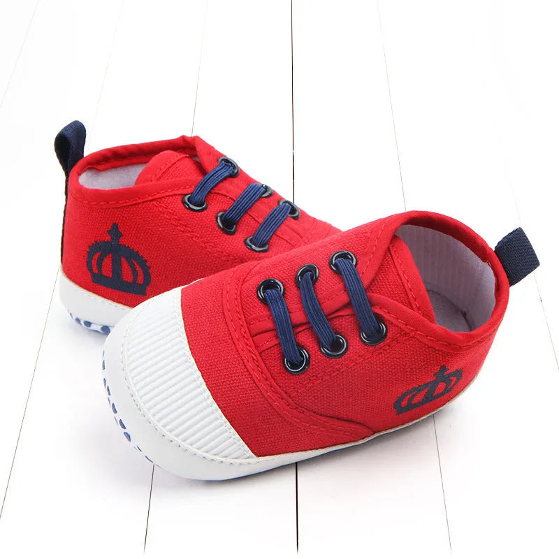 Red and white canvas toddler shoes with elastic band closure in three size options