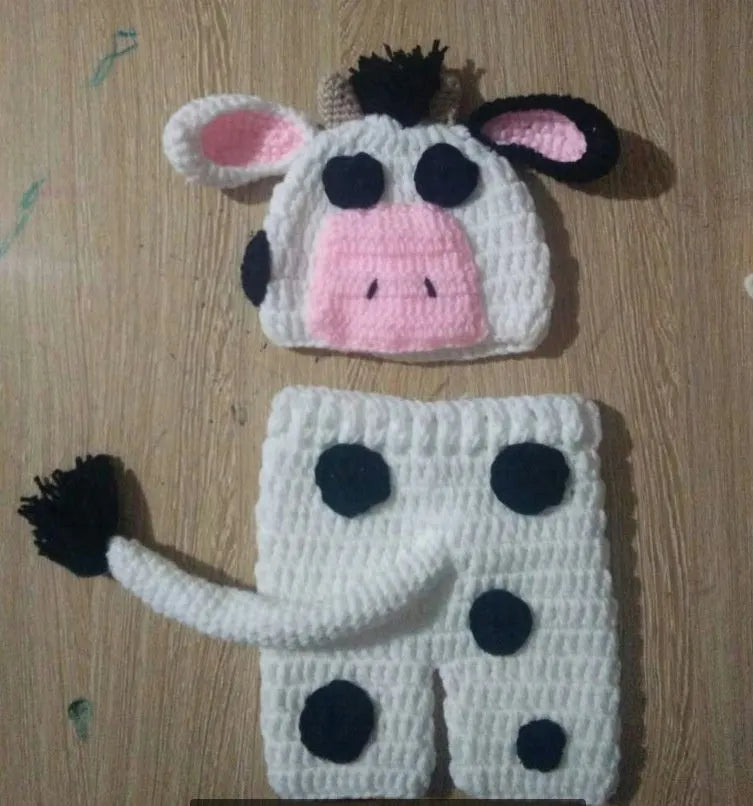 Hand-knitted white baby cow suit with matching hat for 0-3 month newborns