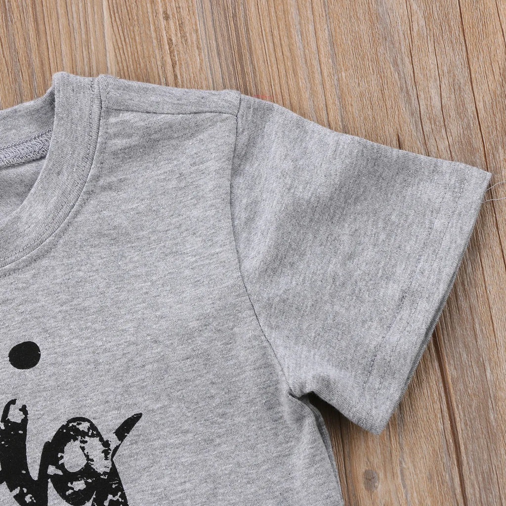 Grey printed cotton t-shirt showing sibling designs available in nine sizes from 60cm to 140cm