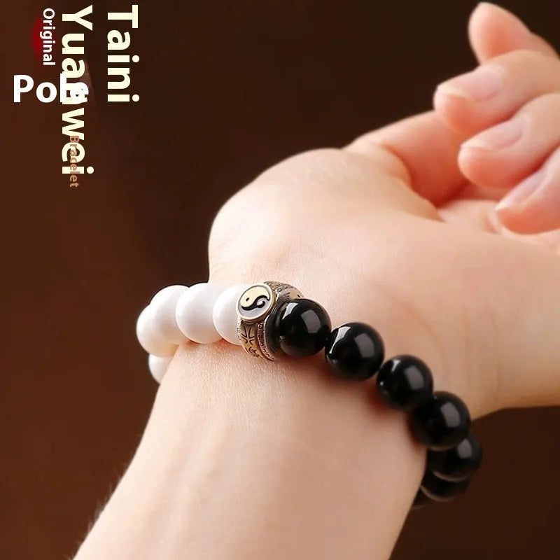 Black and white woven Taiji and Mantra bracelet on obsidian beads.