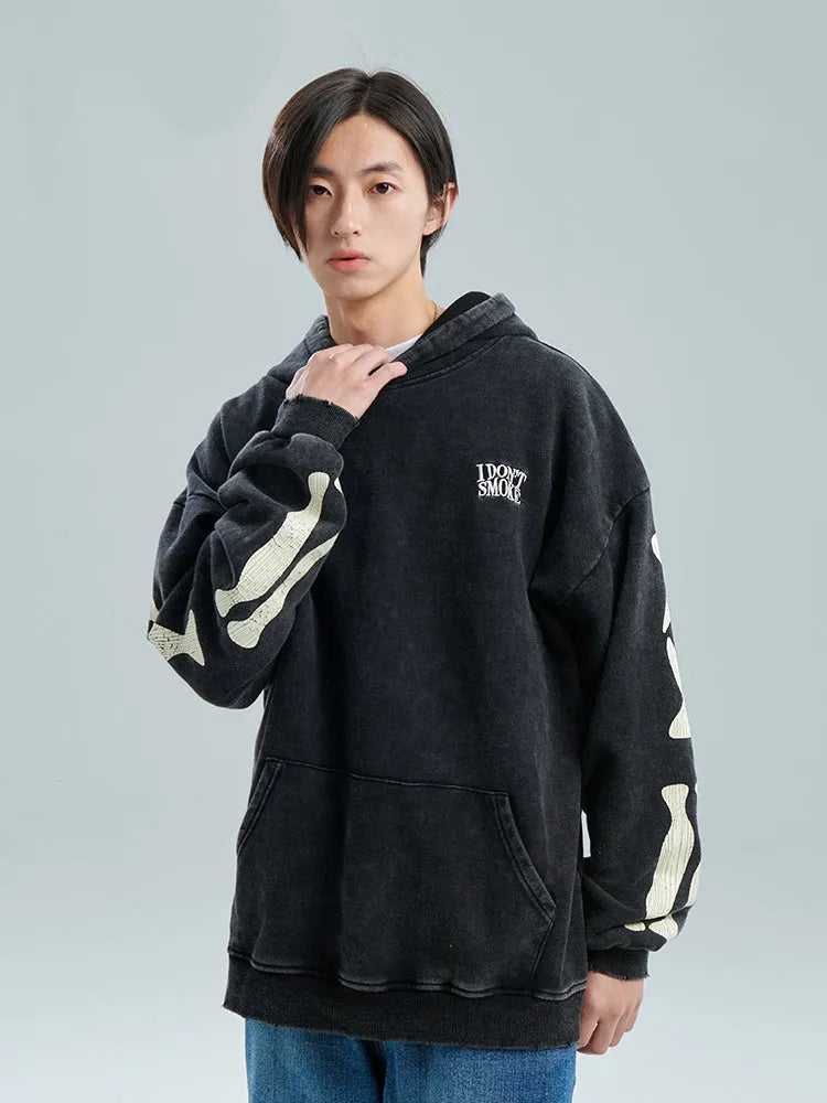 Black printed hoodie with hood and loose fit, 100% cotton, front view