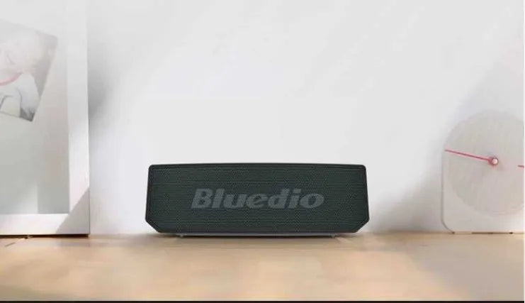 Black BS-6 Cloud Smart Speaker with micro-USB port and compact design.