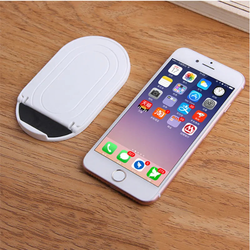 Plastic lazy bracket mobile phone stand in multiple colour options on desk