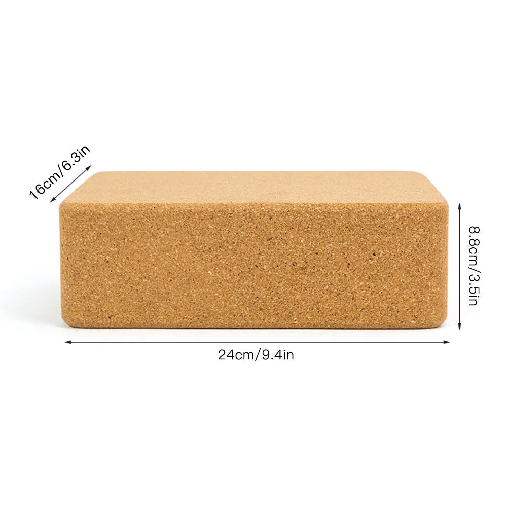 Yellow cork yoga brick with beveled edges and nonslip surface, size 24x16x8.5cm, on a plain background