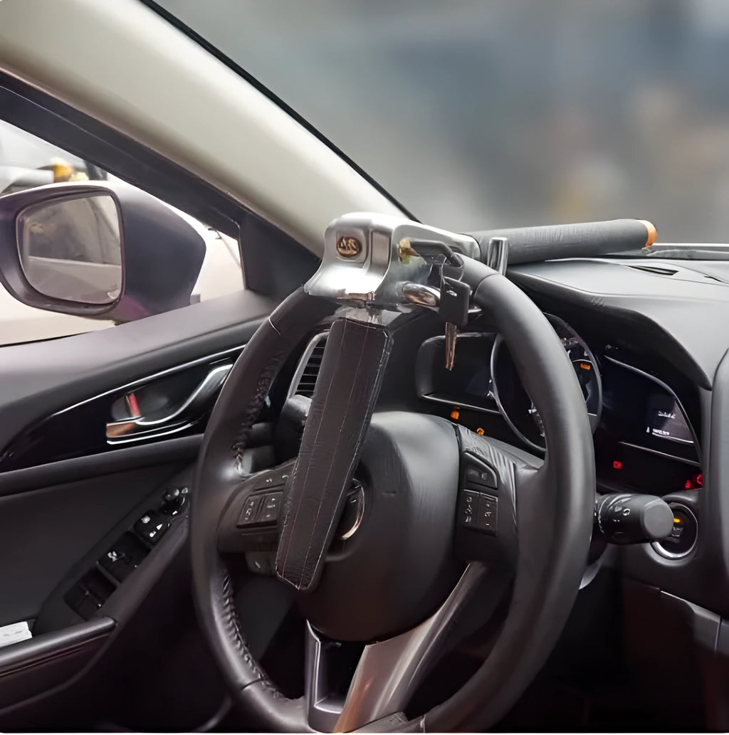 Black and silver car steering wheel lock with alloy body, copper cylinder, two keys, and three-way locking design.