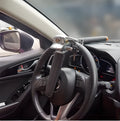 Black and silver car steering wheel lock with alloy body, copper cylinder, two keys, and three-way locking design.