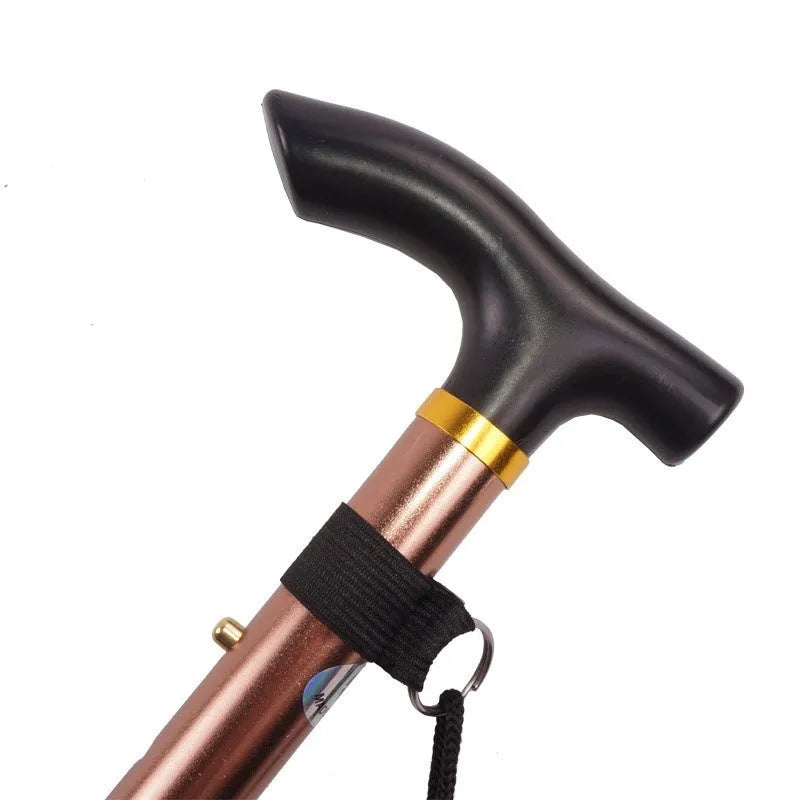 Aluminium folding walking cane extended, showing non-slip handle and adjustable shaft.
