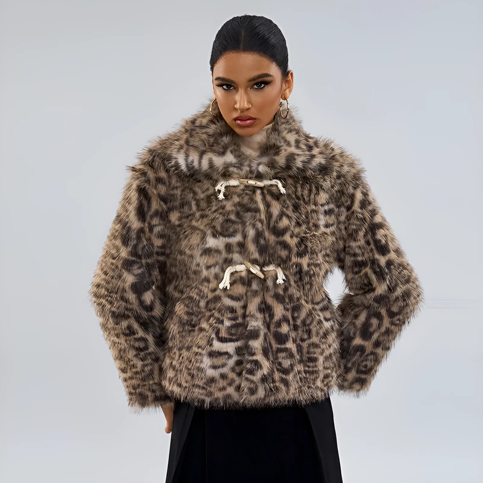 Women's leopard print fashion coat with a buckle lapel on the collar.