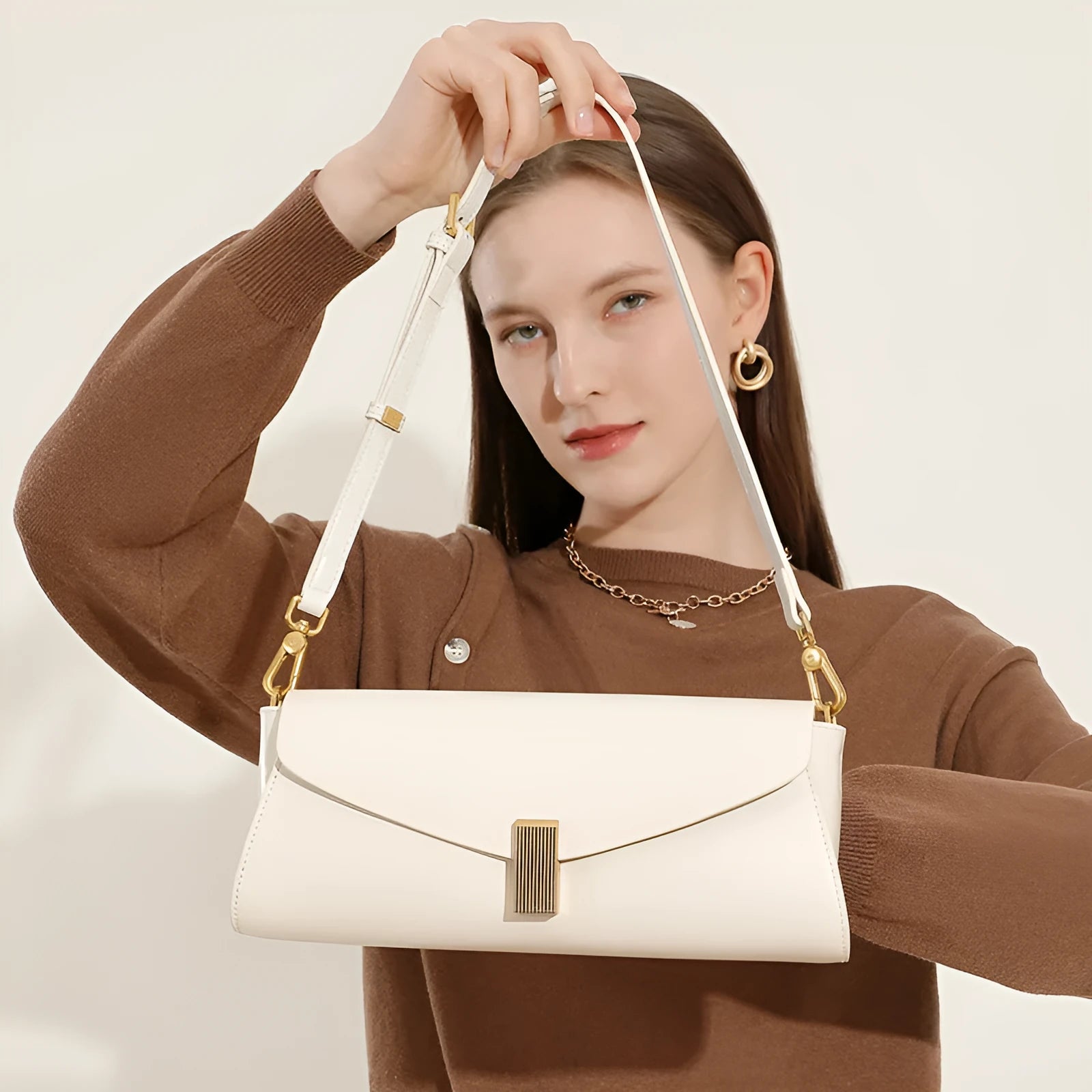 Women's cowhide leather cross-body bag in clamshell design with internal organisers