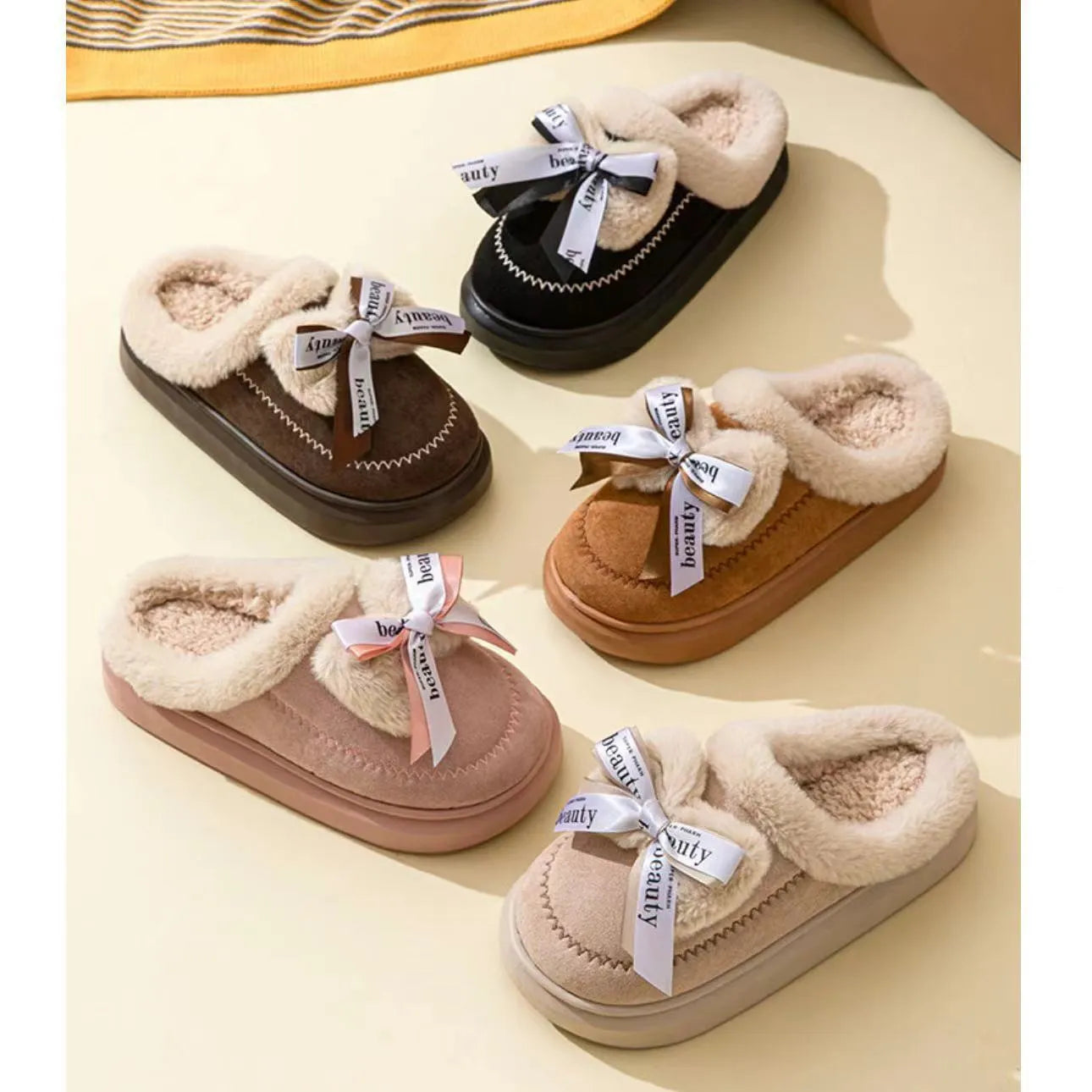 Women's beige suede half slippers with a thick sole and wool lining on a wooden floor.