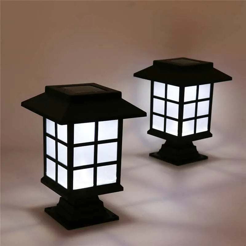 Black solar-powered LED lawn light for outdoor garden and pathway illumination with waterproof construction