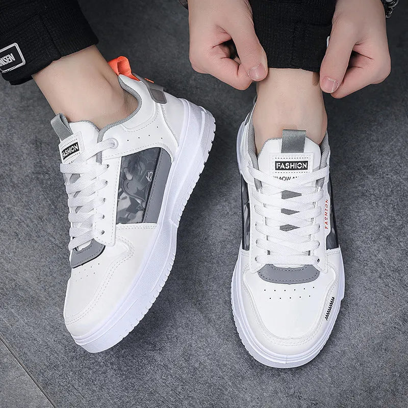 Men's white casual sneakers with lace-up front, low heel, and mesh lining, side view.