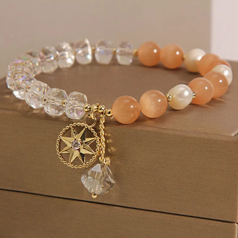 Orange opal crystal bracelet with gold-plated eight awn star design and artificial gemstone inlay