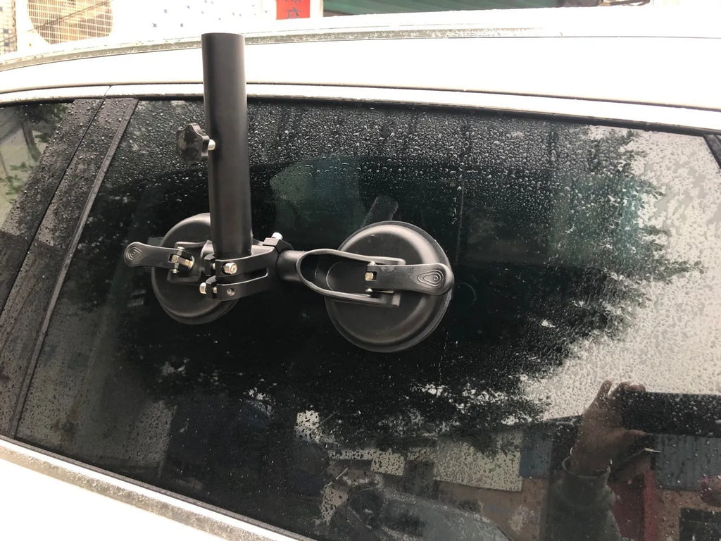 Black off-road car sucker base with round rubber suction cup for mounting on vehicle windows.