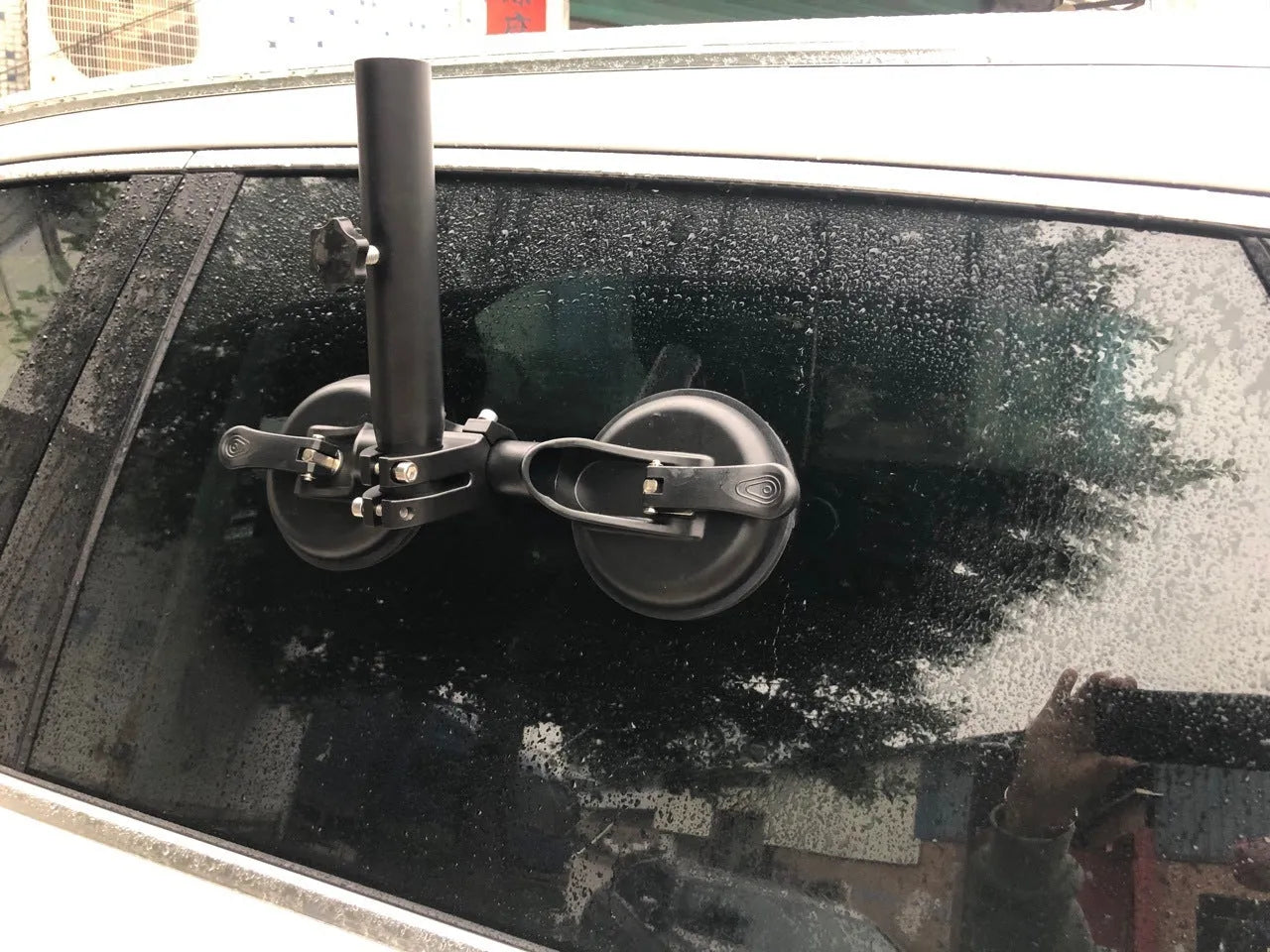 Black off-road car sucker base with round rubber suction cup for mounting on vehicle windows.