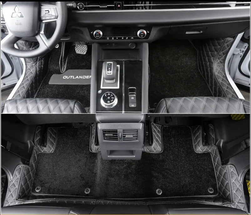 Mitsubishi Outlander full surround floor mats in black, fitted in a car footwell.