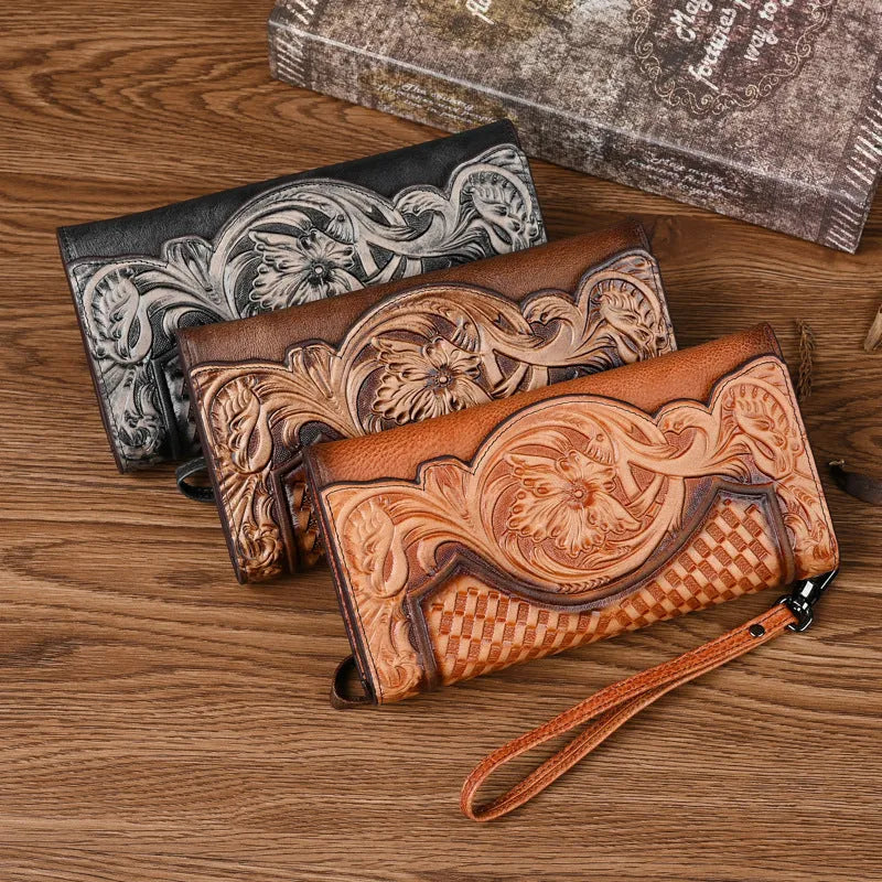 Retro brown Chinese floral embossed tri-fold women's leather wallet open to show compartments.