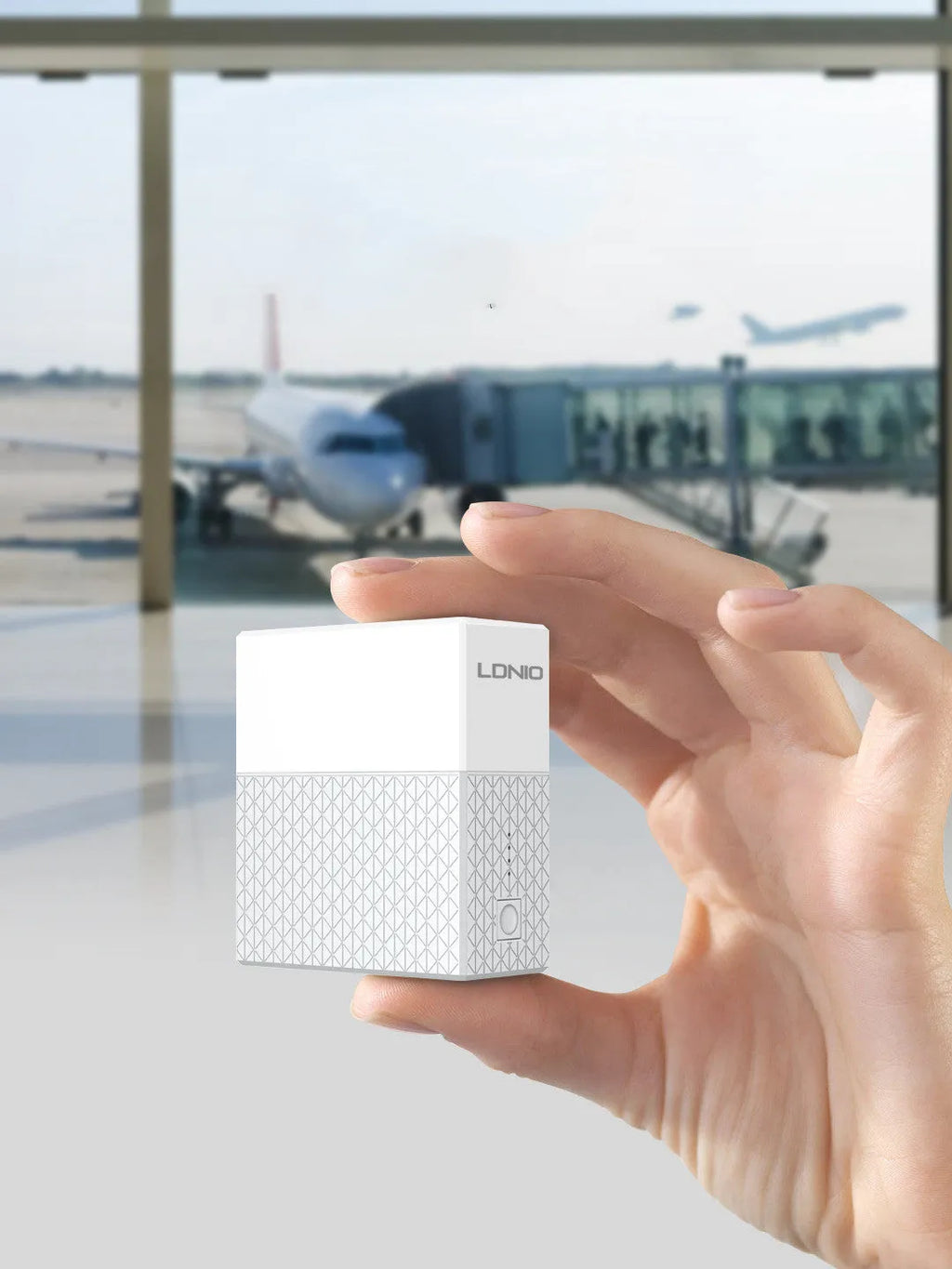 White two-in-one power bank charger with integrated plug, showing UK/US/EU pins and 5200mAh capacity.