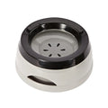 Floating no-spill pet bowl in ABS plastic, 15.3x18.9x8cm, shown in grey, green, pink or blue