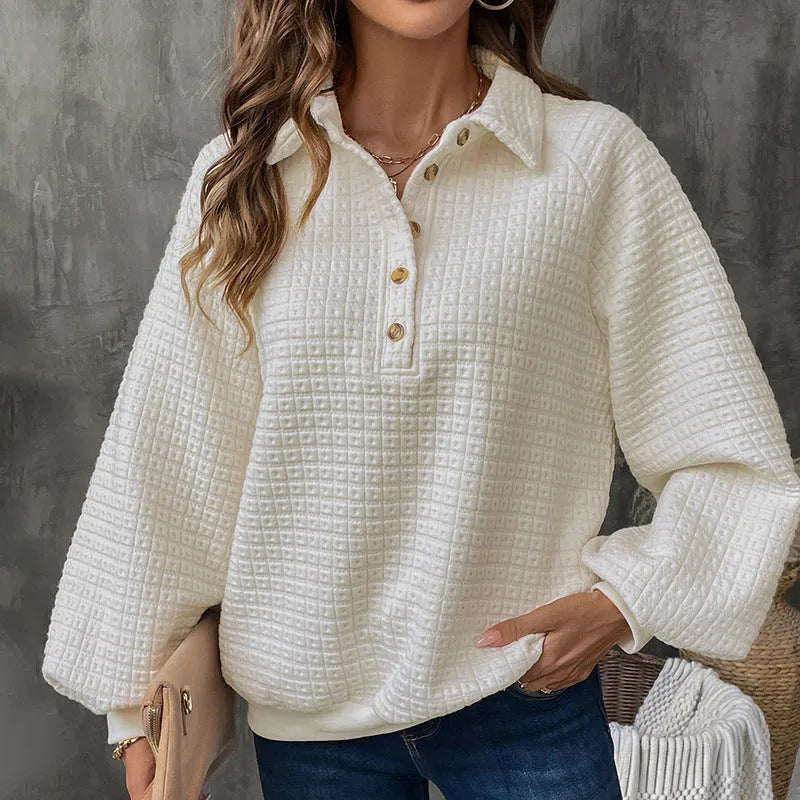 Women's milky white polo collar pullover sweater with long sleeves on a hanger.
