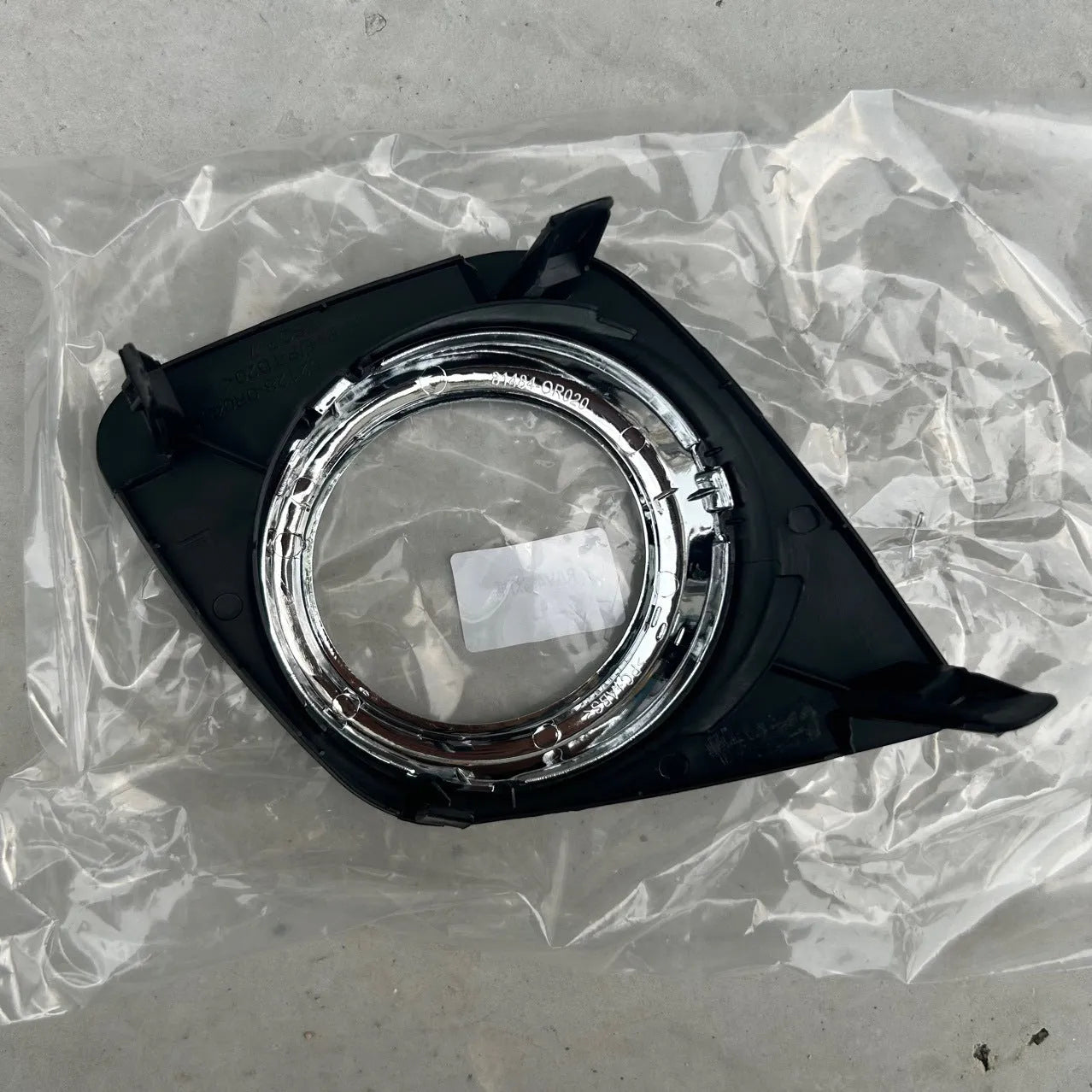 Toyota RAV4 front bumper fog light cover set showing both driver and passenger side black replacement pieces
