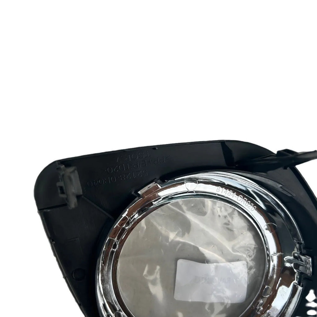 Toyota RAV4 front bumper fog light cover set showing both driver and passenger side black replacement pieces