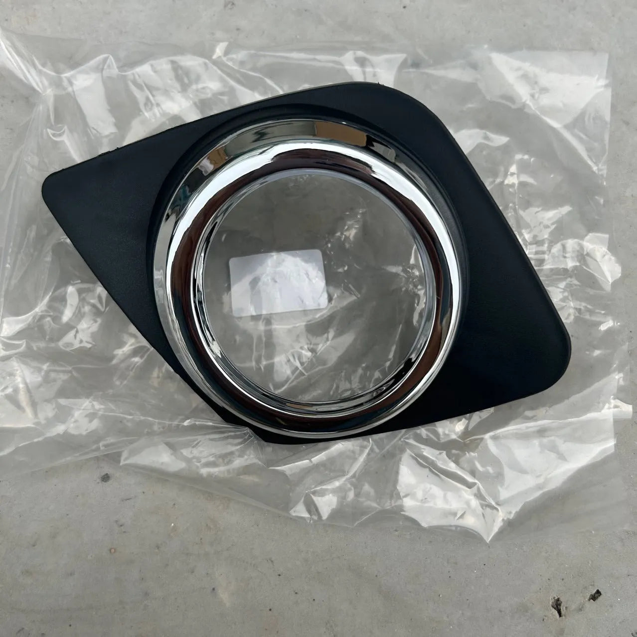 Toyota RAV4 front bumper fog light cover set showing both driver and passenger side black replacement pieces