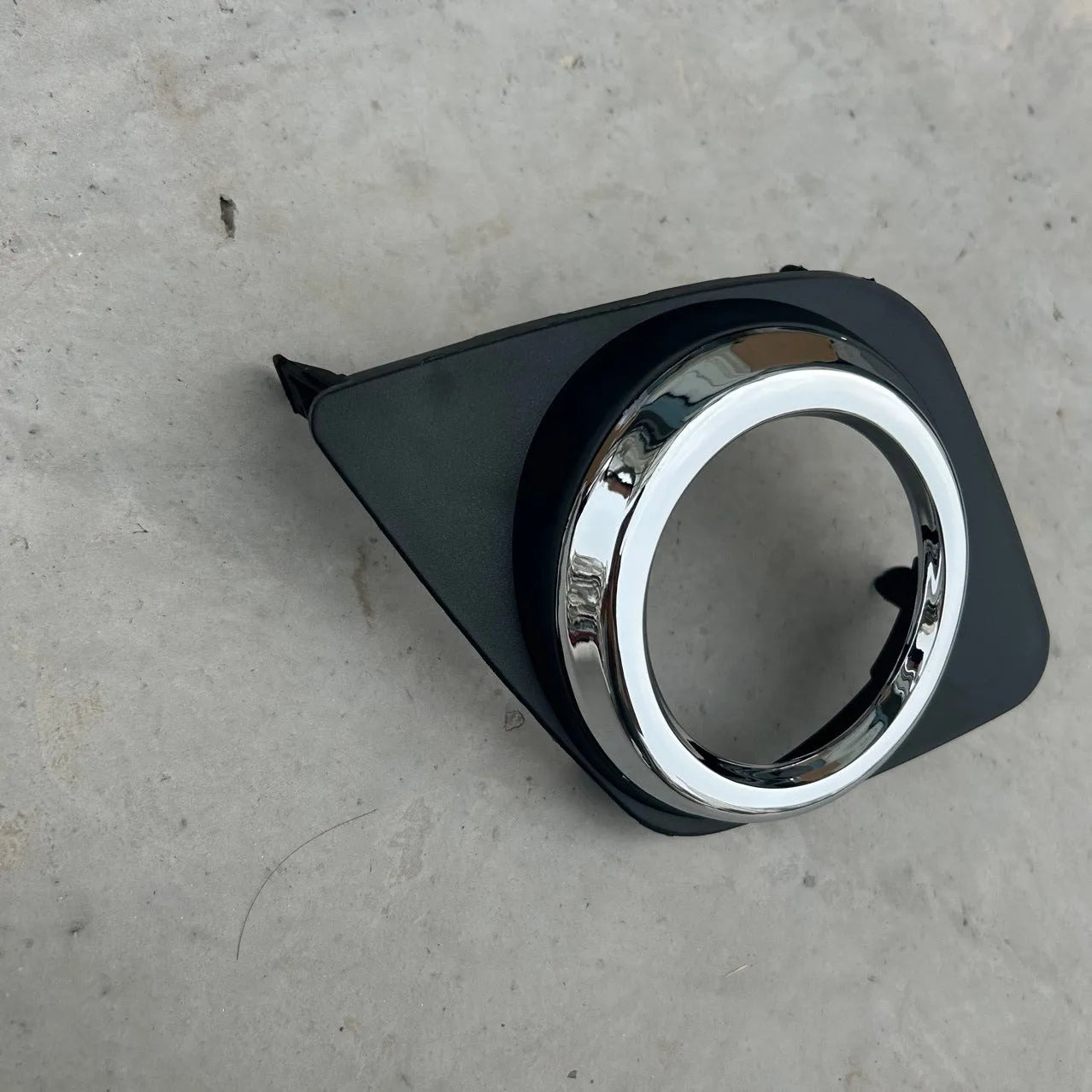 Toyota RAV4 front bumper fog light cover set showing both driver and passenger side black replacement pieces