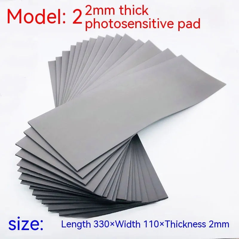 Black and grey plastic light-sensitive mat for seal making, shown in 7mm, 4mm, and 2mm thickness options.