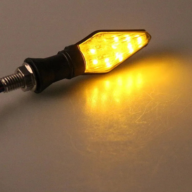 Motorcycle LED turn signal lights with double-sided luminous design showing yellow and blue lighting