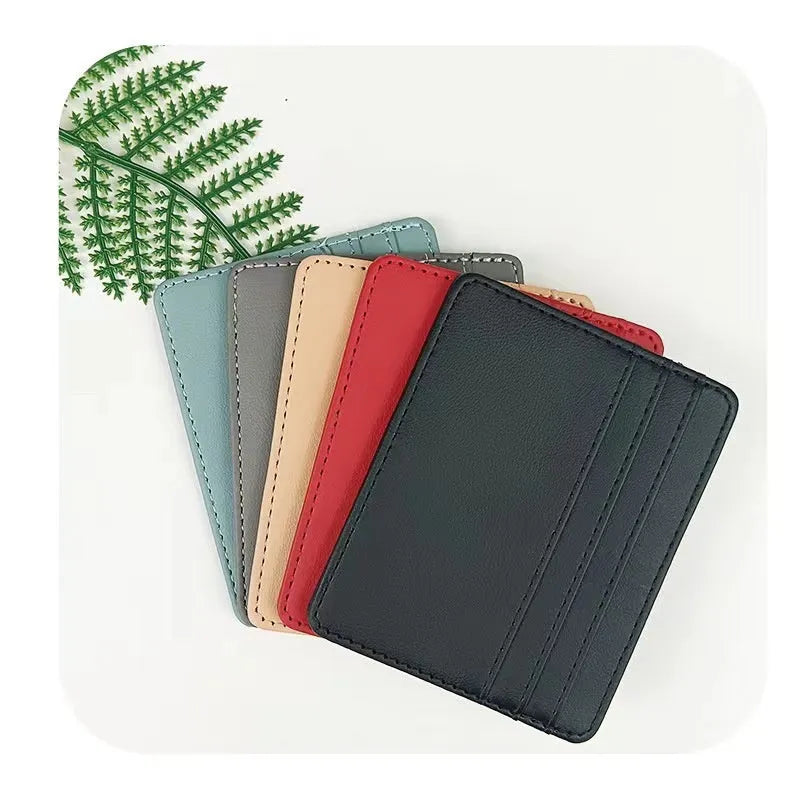 Compact leather cutting ferrule with multiple card slots in black, showing the front exterior and card storage capacity