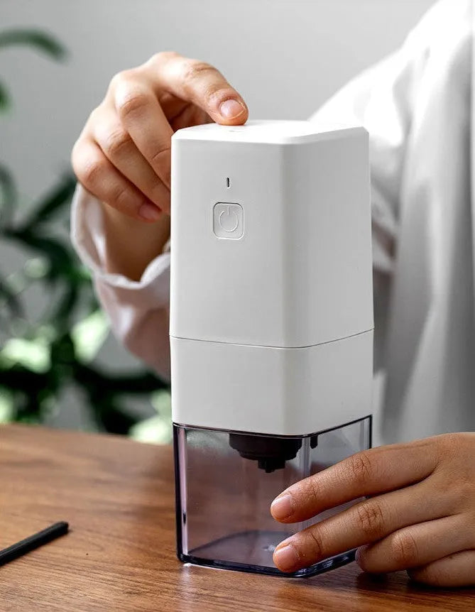Square electric coffee bean grinder in black with USB Type-C charging port and copper motor, 25-30g capacity