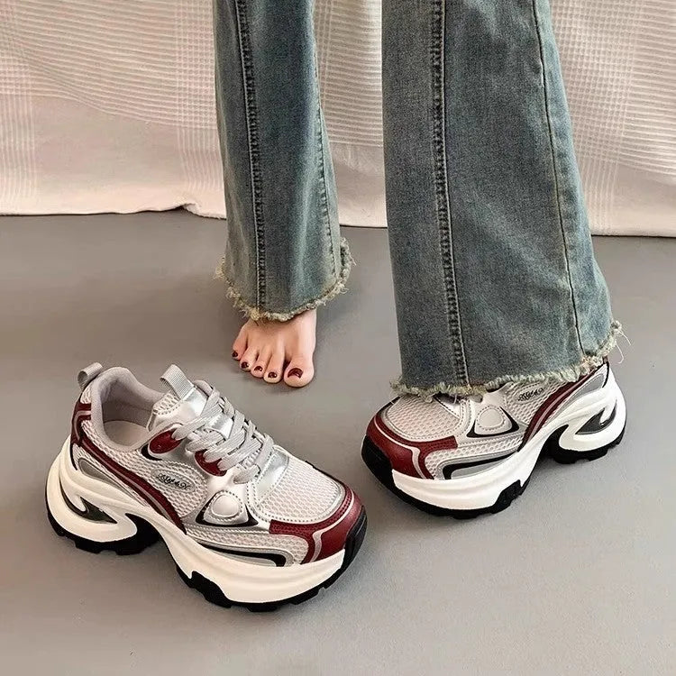 Women's silver mesh clunky platform sneakers with round toe and lace-up front.