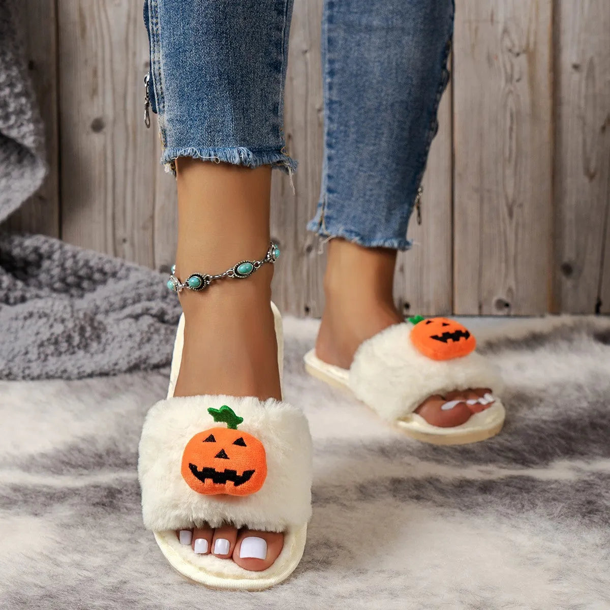 Pumpkin-themed plush slippers with open toe design and anti-slip PVC soles in white and yellow colour options