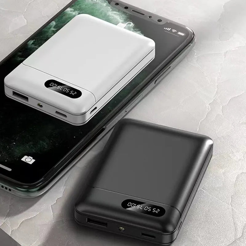 Black or white portable power bank with dual USB ports showing capacity options