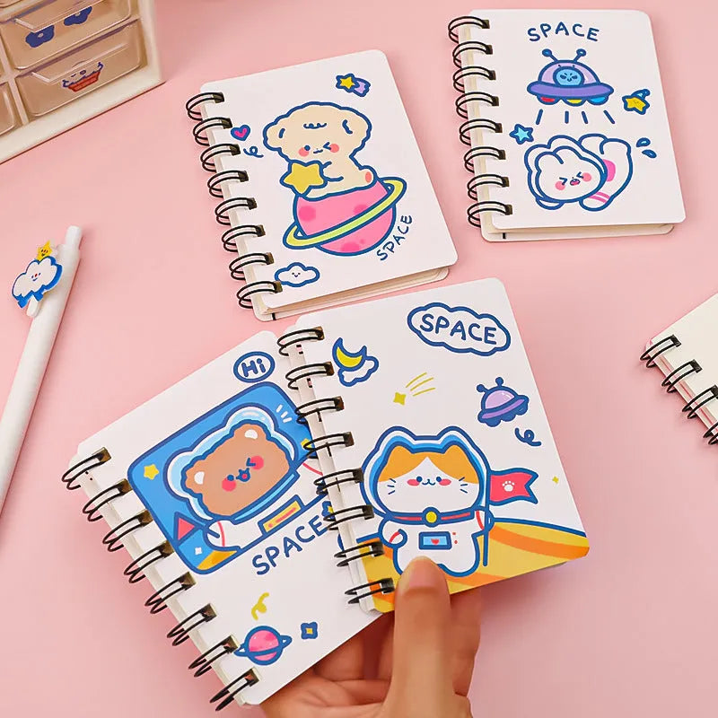 Astronaut series pocket notebook in 10.5cm by 8cm size, showing cover options: Astronaut Bear, Planet Teddy, Space Cat, UFO.