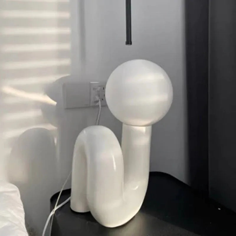 Modern Nordic style resin bedside lamp in pink with international plug adapter options