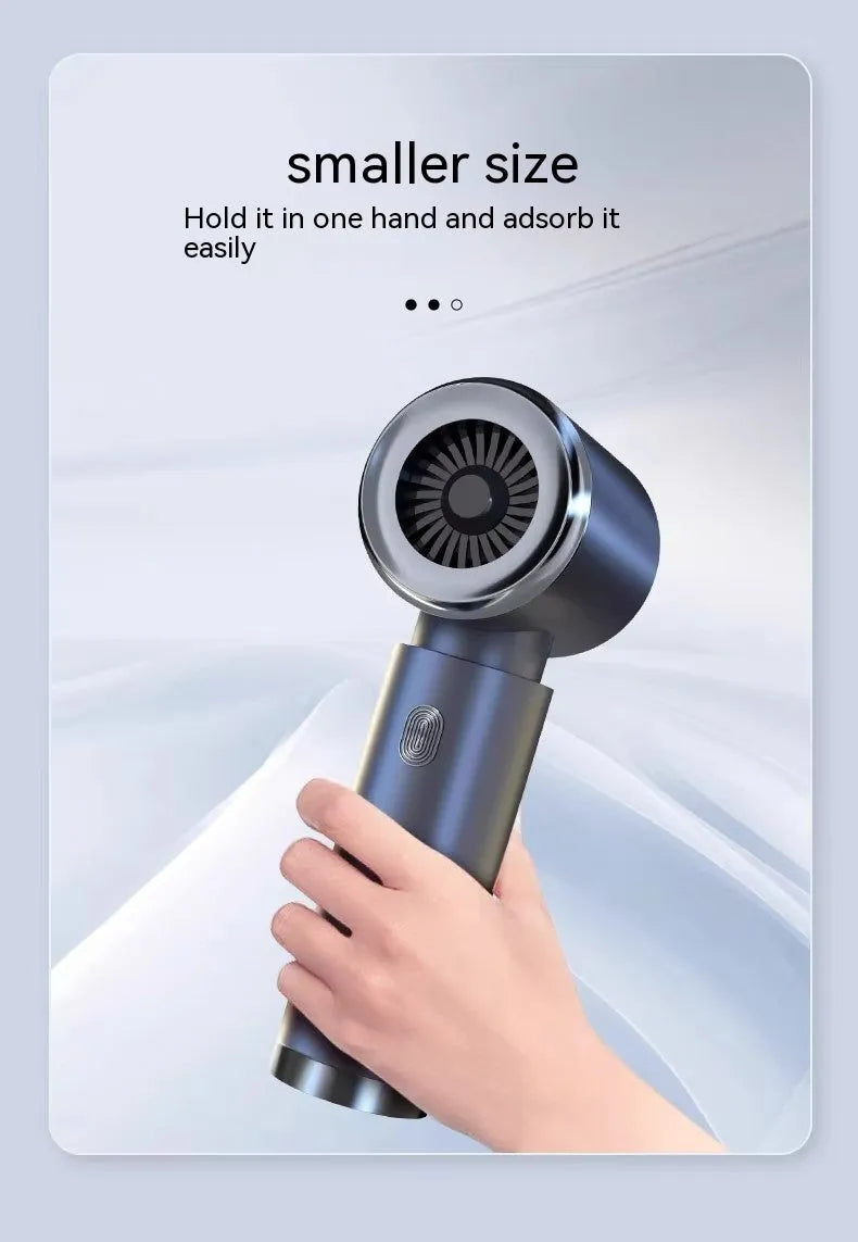 Handheld wireless car vacuum cleaner in space-like grey colour with blowing and suction functions