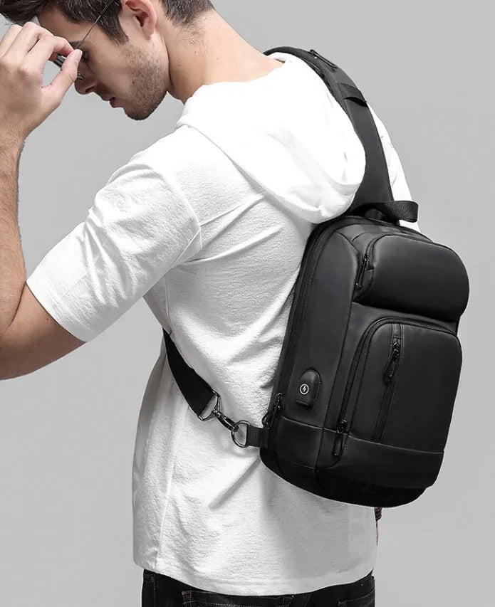 Black medium outdoor shoulder bag with air cushion strap and internal organisers
