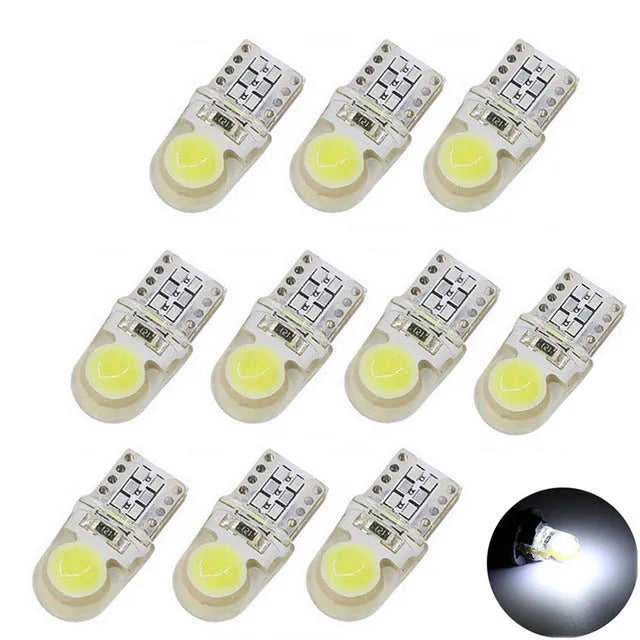 Pack of ten T10 wedge base LED bulbs for cars in seven different colours on a white background