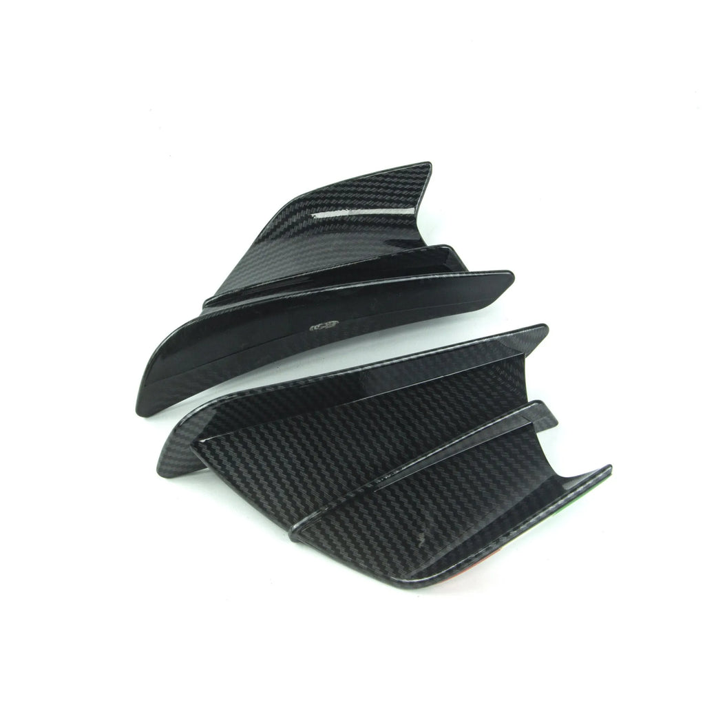 Universal motorcycle spoiler wings in four finish options: pure black, glossy forged, glossy carbon fibre, and elegant black carbon fibre pattern