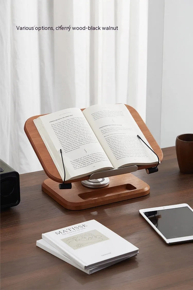 Solid wood adjustable reading rack in walnut colour holding a book on a table.