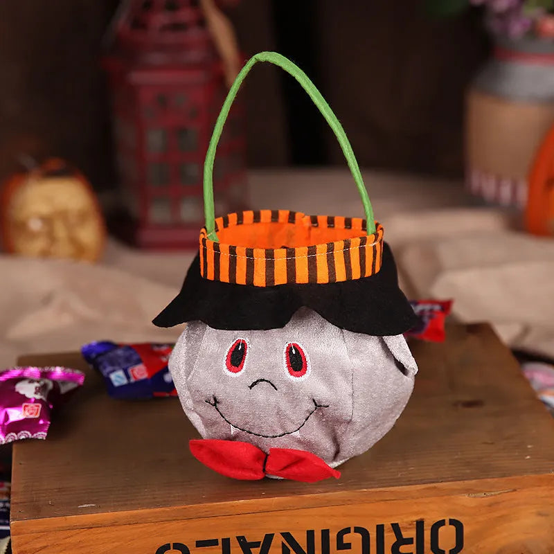 Halloween candy bag with pumpkin design measuring 16cm square in velvet fabric
