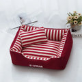 Navy striped washable dog kennel mat with removable cover and a red mini pillow.