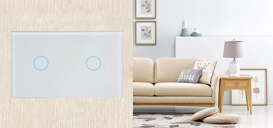 White smart touch light switch with tempered glass panel and silver frame on a wall.