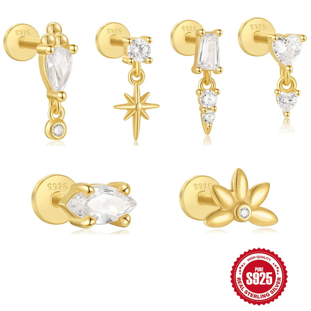 Close-up of a sterling silver ear stud with a gold-toned tassel inlay design.